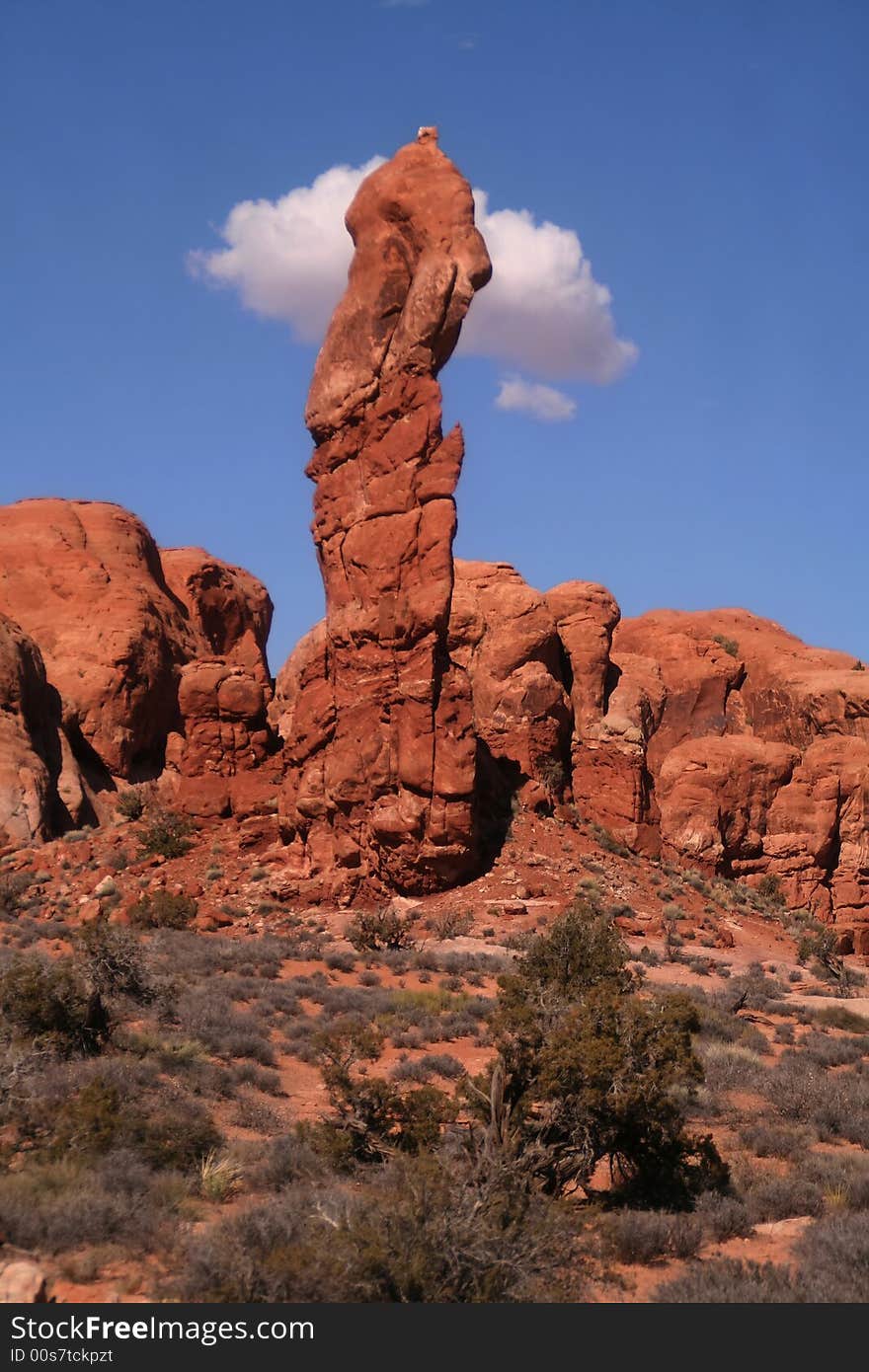 View of the red rock formations in Arches National Park with blue sky�s and clouds. View of the red rock formations in Arches National Park with blue sky�s and clouds