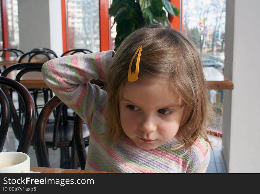 Thinking kid with her hand on her head