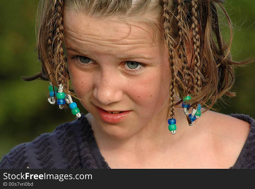 Girl at beach with hair in braids