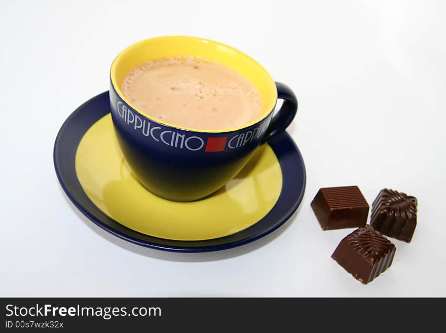 A cup of capuccino on white background. A cup of capuccino on white background.