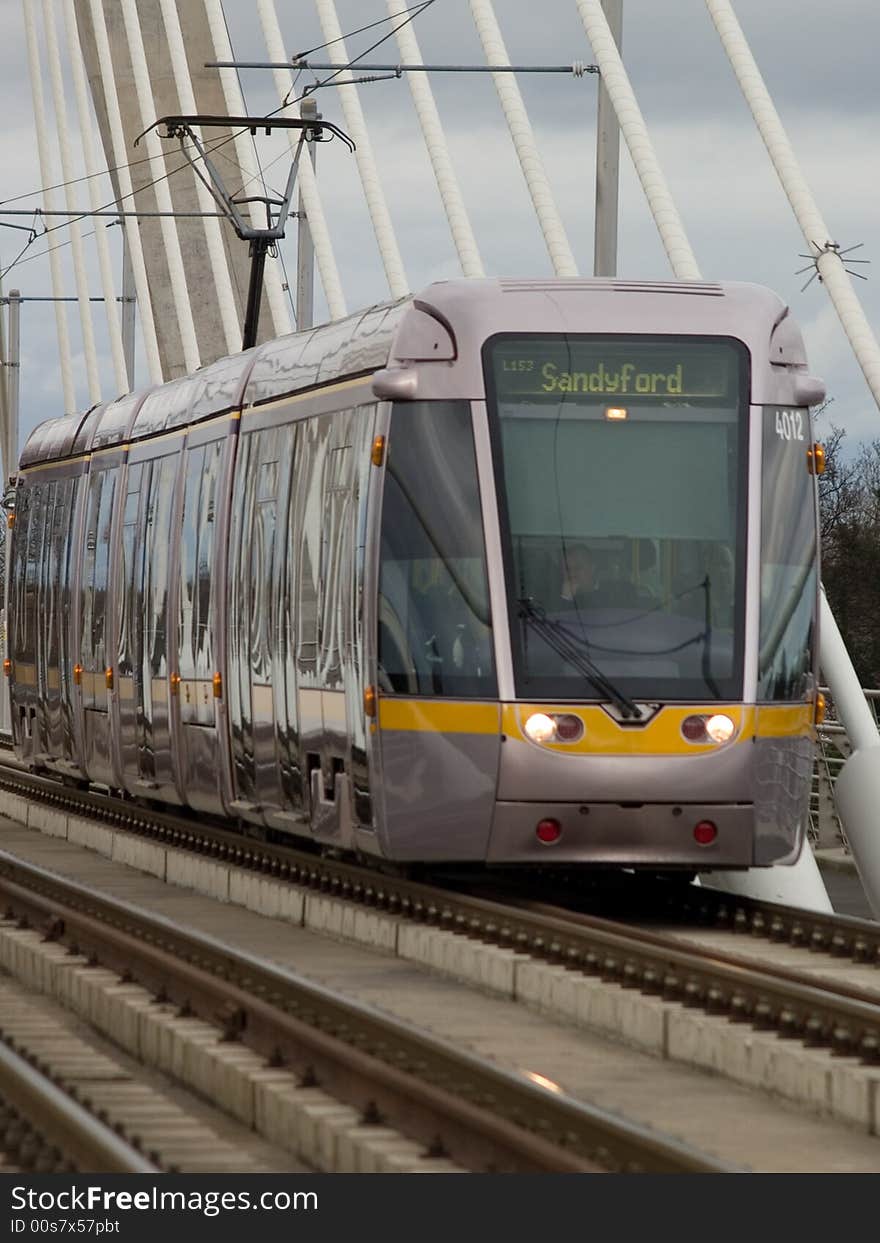 Modern tramway crossing a bridge