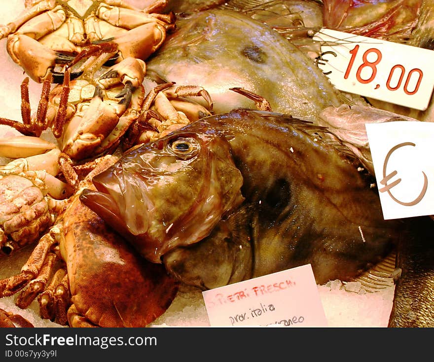 Fish and crabs on counters of the Venetian market