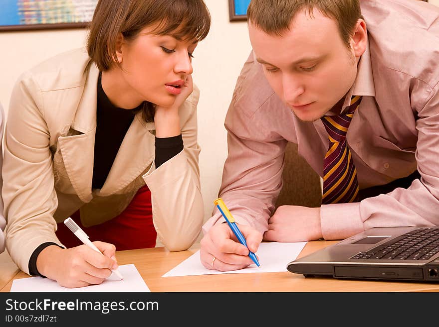 Pair of managers communicating, working at office. Pair of managers communicating, working at office