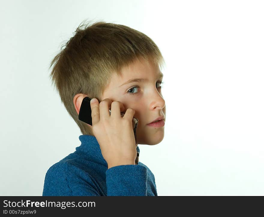 Little boy talking by cell phone