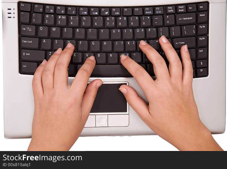 Hands on computer keyboard from top view