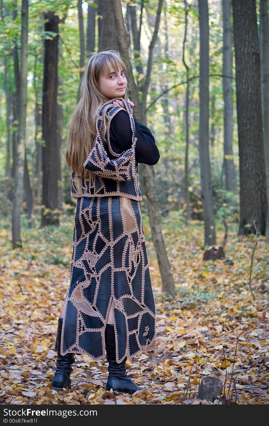 Portrait of the beautiful girl in autumn forest. Portrait of the beautiful girl in autumn forest.