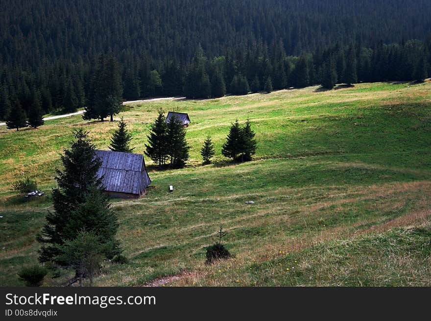 Mountains, house and meadow