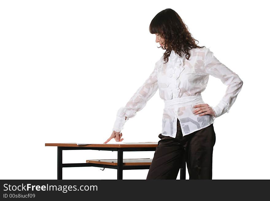 The business woman studies documents laying on a table