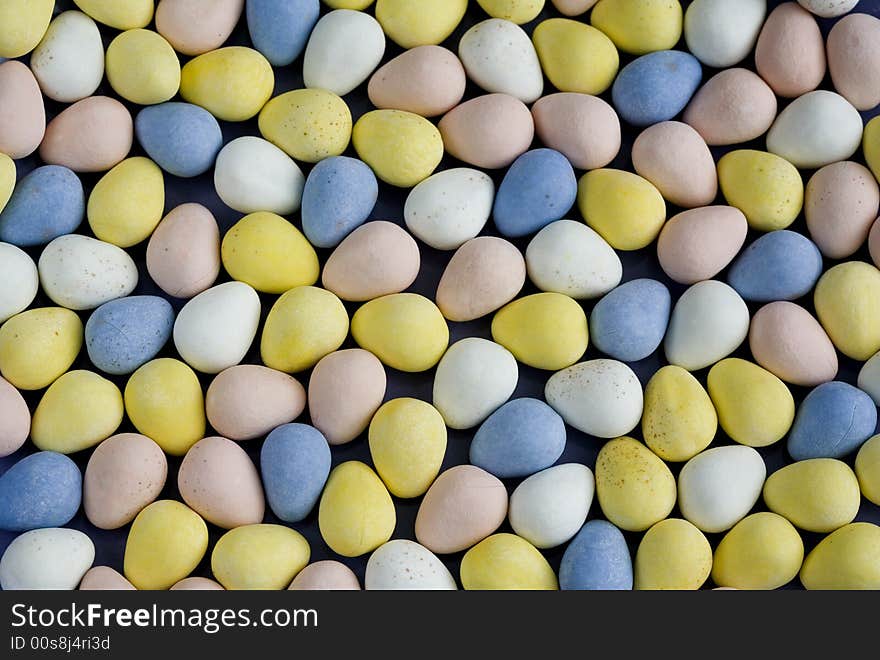 Colorful coated chocolate egg-shaped candies for Easter. Colorful coated chocolate egg-shaped candies for Easter