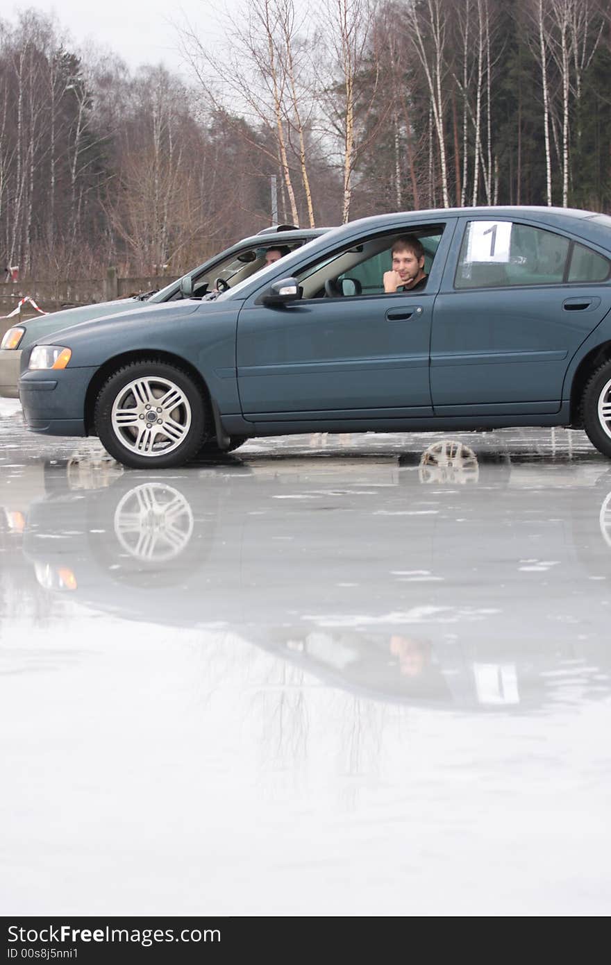 Two cars ready to drive on icy road. Two cars ready to drive on icy road