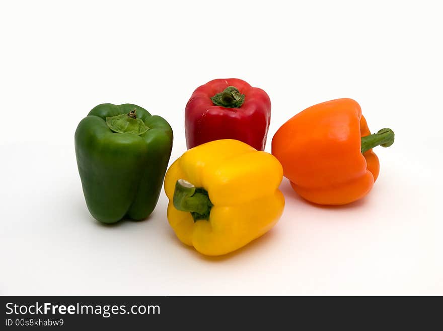 A shot of several peppers of multiple colors. A shot of several peppers of multiple colors.