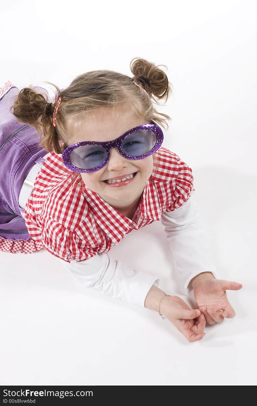 Cute little girl with funny sunglasses. Cute little girl with funny sunglasses