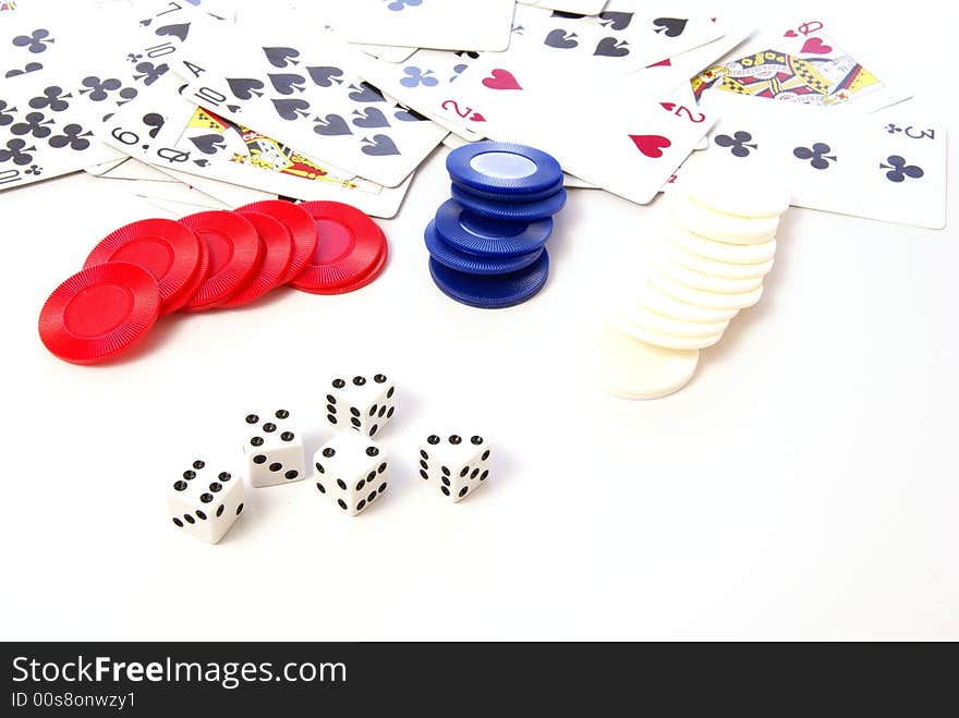 Multiple white dice with red and blue poker or game chips. Multiple white dice with red and blue poker or game chips