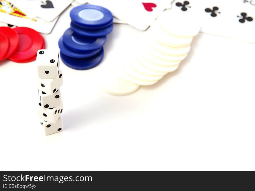 Multiple white dice with red and blue poker or game chips. Multiple white dice with red and blue poker or game chips