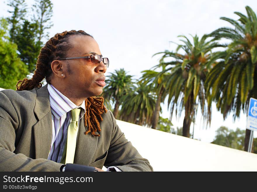 Businessman Sitting outside enjoying the day. Businessman Sitting outside enjoying the day.