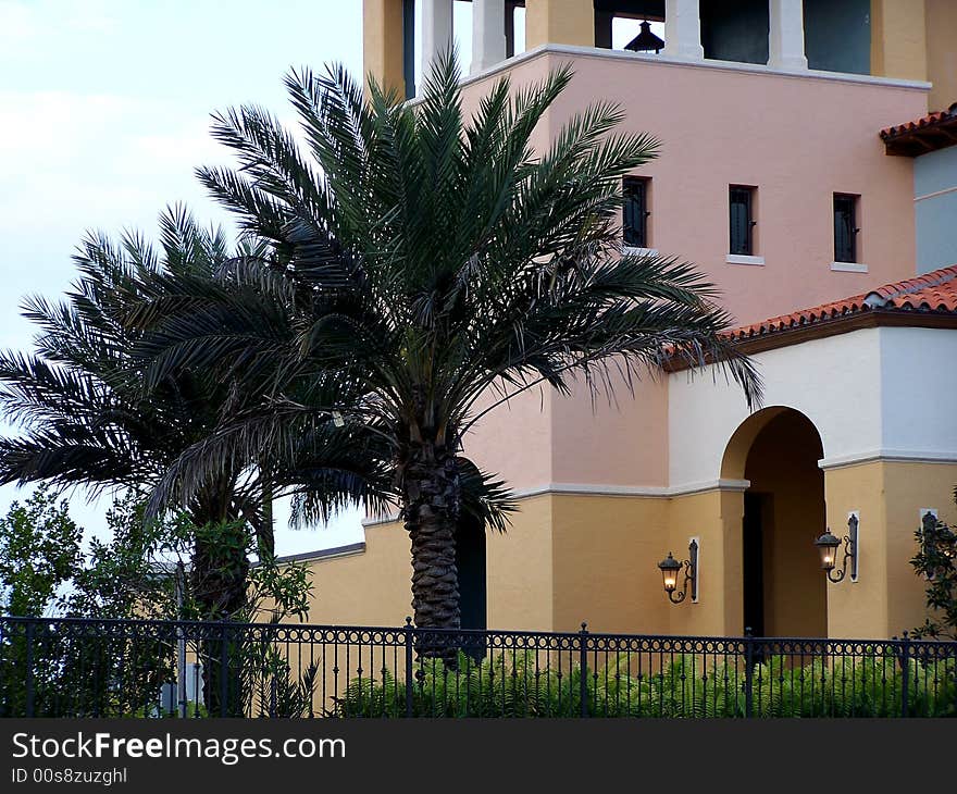 Palm Trees line the Spanish Style building along St. Lucie River. Palm Trees line the Spanish Style building along St. Lucie River