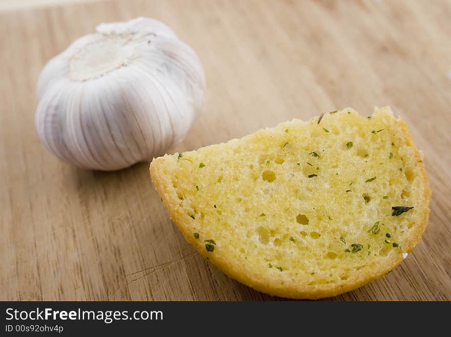 Small Piece of Garlic Bread on cutting board