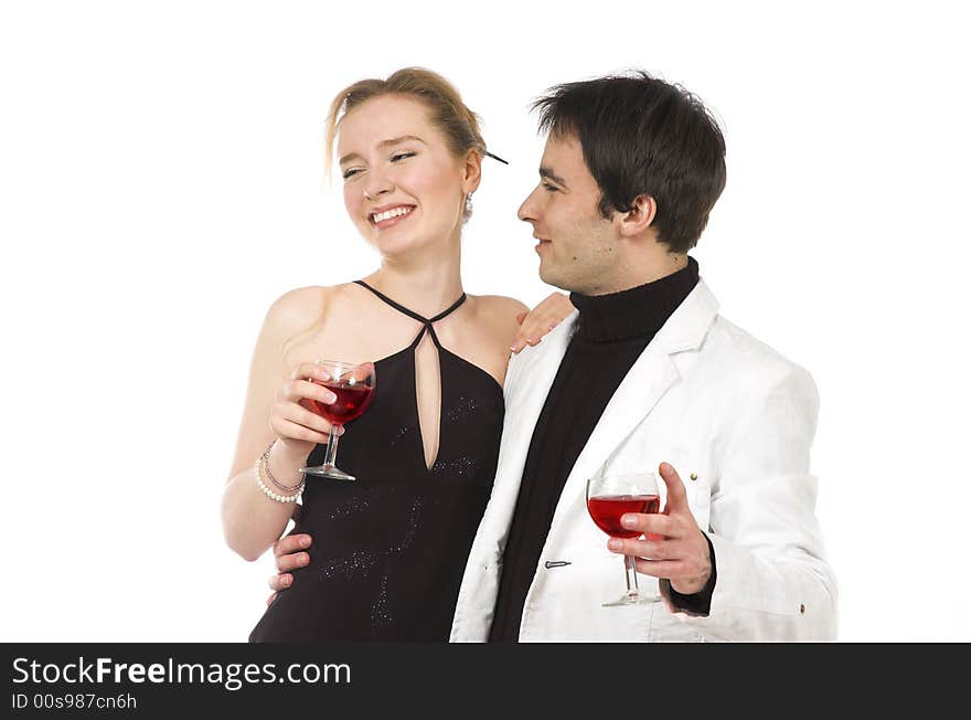 The man and the woman in white clothes with red wine