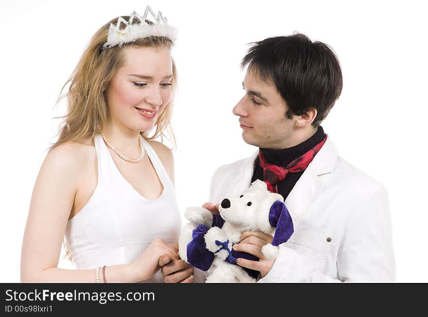 The man gives a toy to the woman on a white background