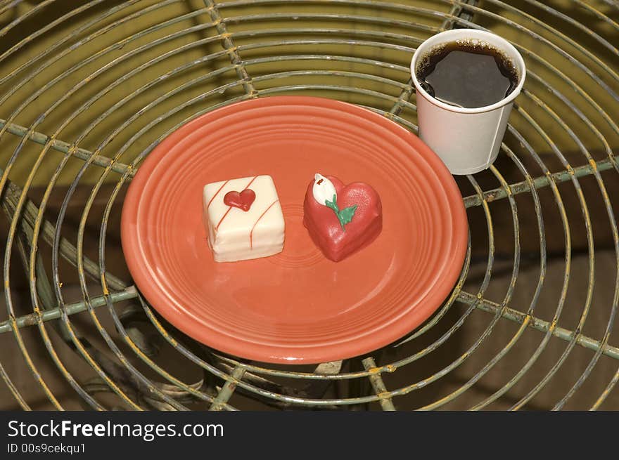 A pair of cup cakes for breakfast on Valentines day with an esspreso coffe. A pair of cup cakes for breakfast on Valentines day with an esspreso coffe