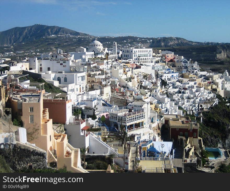 The village of Oia, Santorini, Greece. The whitewashed, sundrenched village that overlooks the caldera. The village of Oia, Santorini, Greece. The whitewashed, sundrenched village that overlooks the caldera