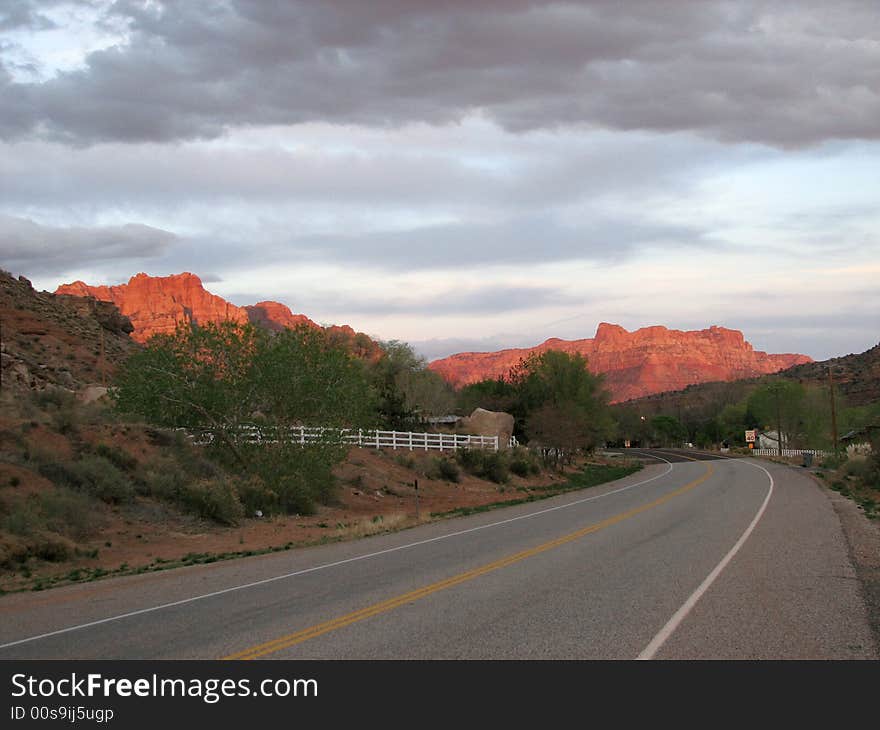 Sunlight lighting up te peaks of Zion National park at sunset. Utah, U.S.A. Sunlight lighting up te peaks of Zion National park at sunset. Utah, U.S.A.