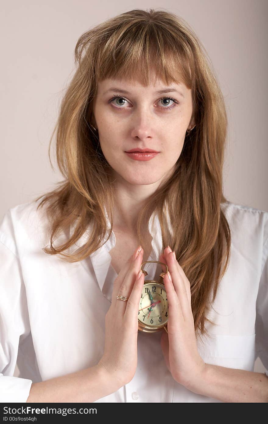 An image of beautiful girl with alarm clock