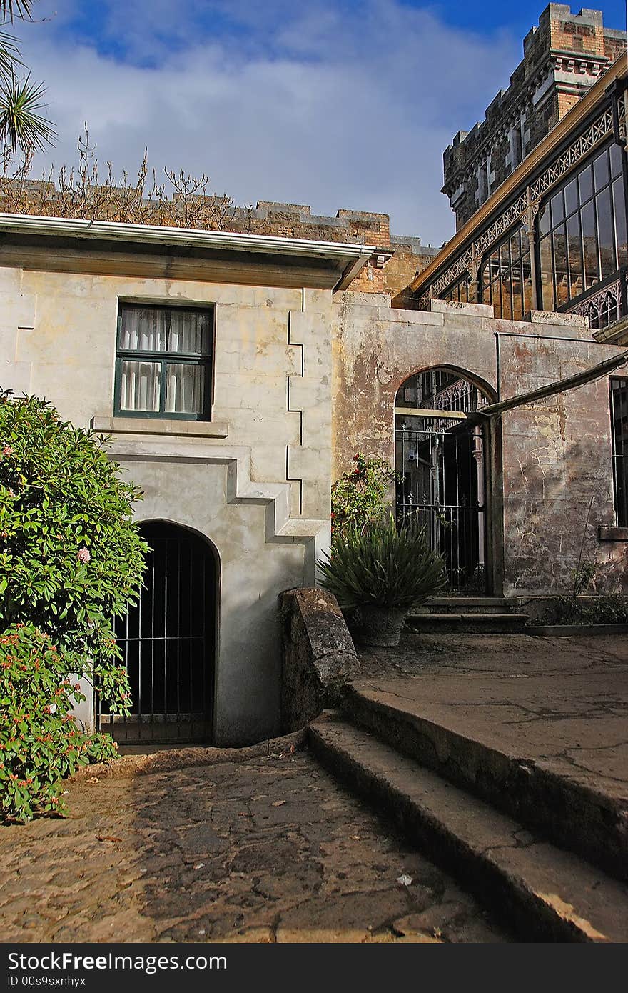 A small courtyard between the main house and the out buildings in an old country mansion. A small courtyard between the main house and the out buildings in an old country mansion.