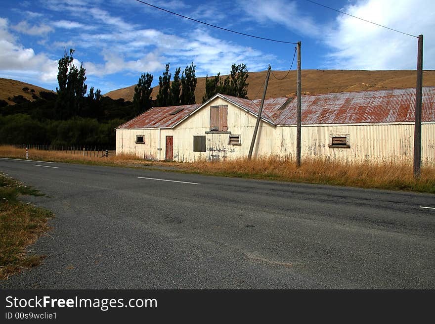 Barn or paddocks on a  sheep ranch/farm in New Zealand. Barn or paddocks on a  sheep ranch/farm in New Zealand