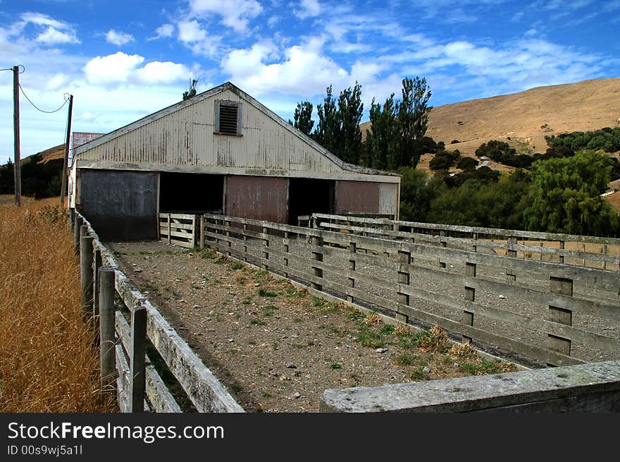 Barn or paddocks on a sheep ranch/farm in New Zealand. Barn or paddocks on a sheep ranch/farm in New Zealand