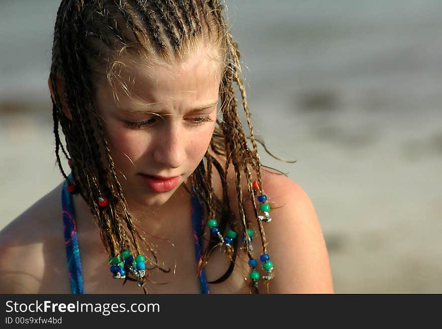 Young girl on beach with braids