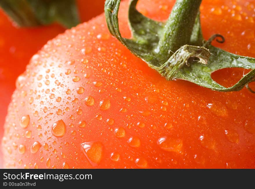 A branch of fresh red tomatoes, a close-up macro