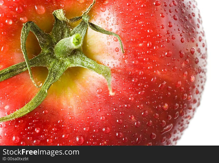 A fresh red apple with tomato twig