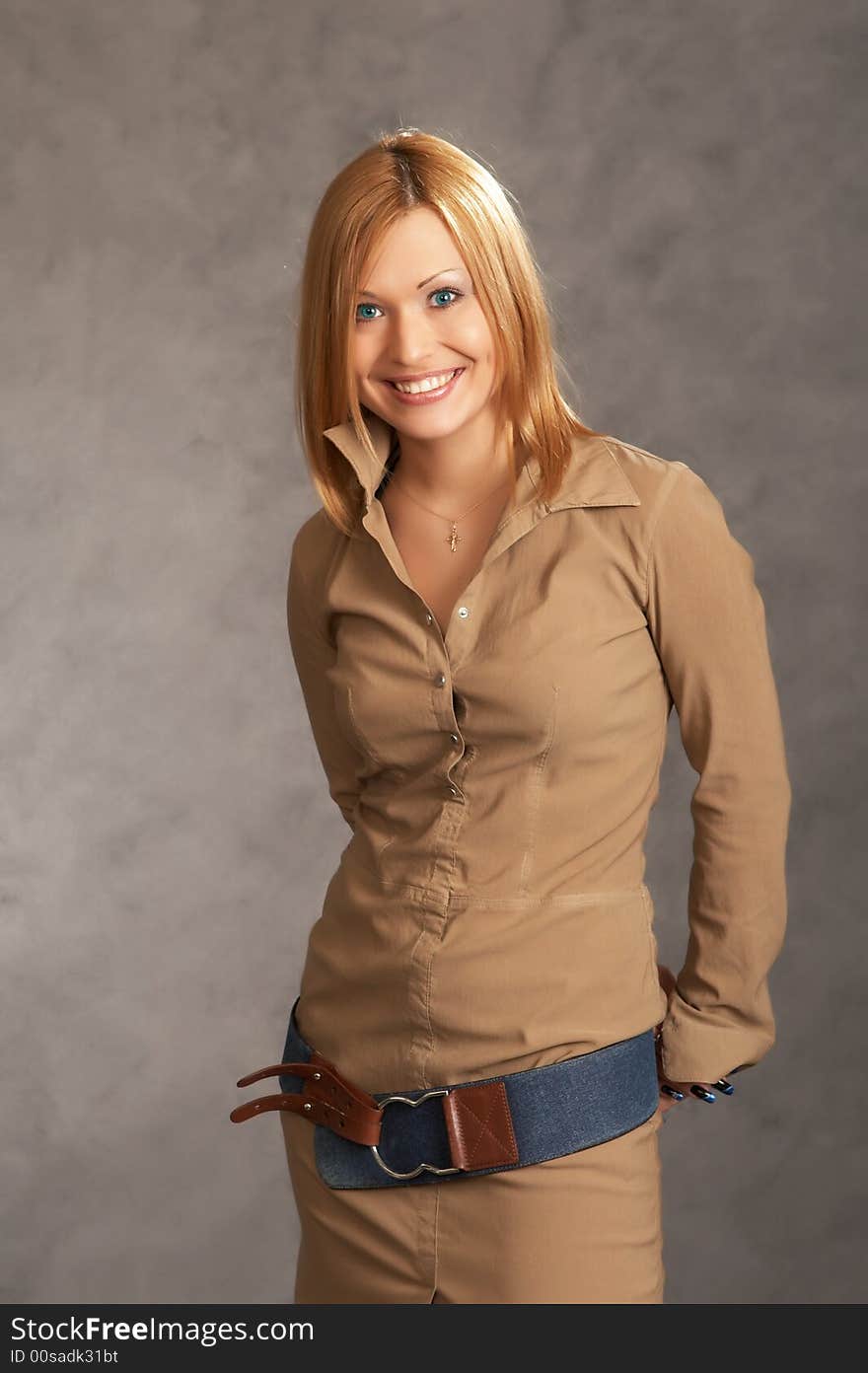 Glamor girl posing on a grey background