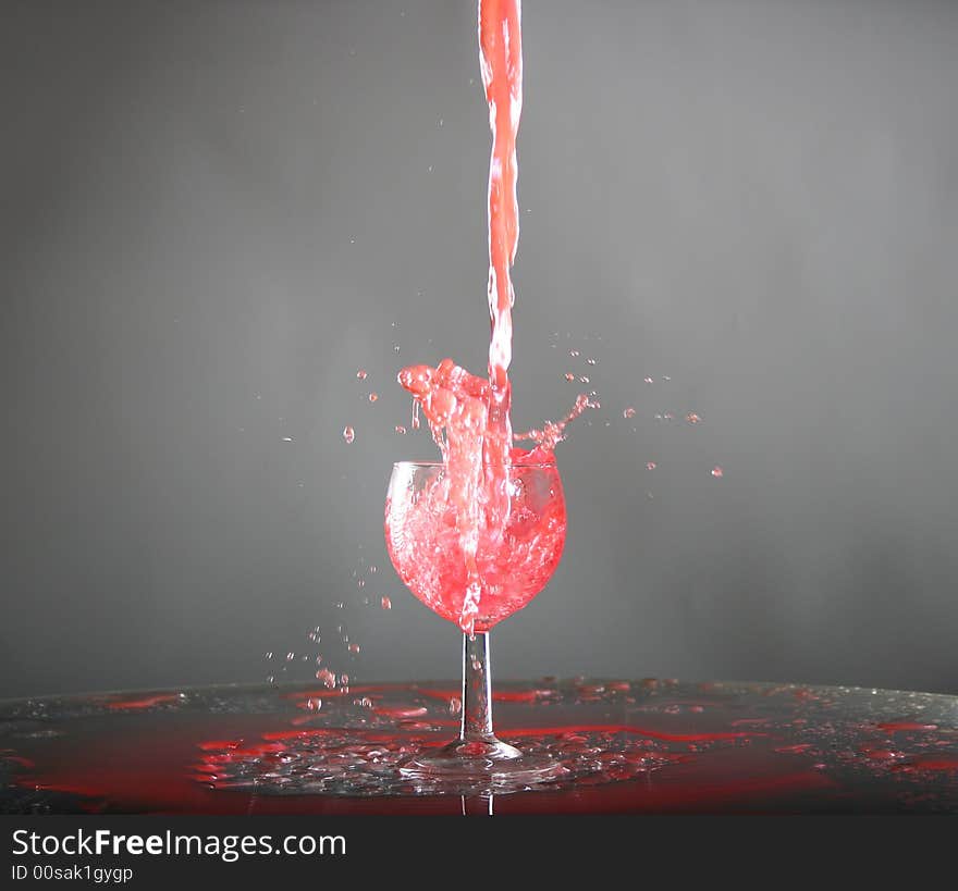 Red wine or juice is splashing