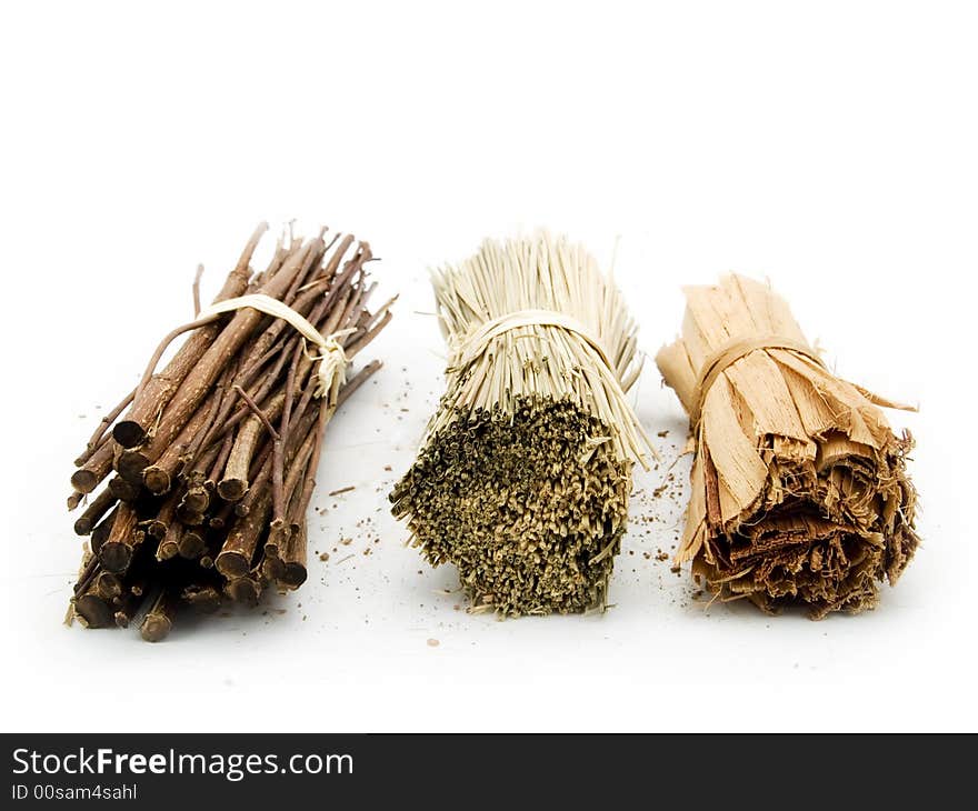 Twig and herbs on a white background