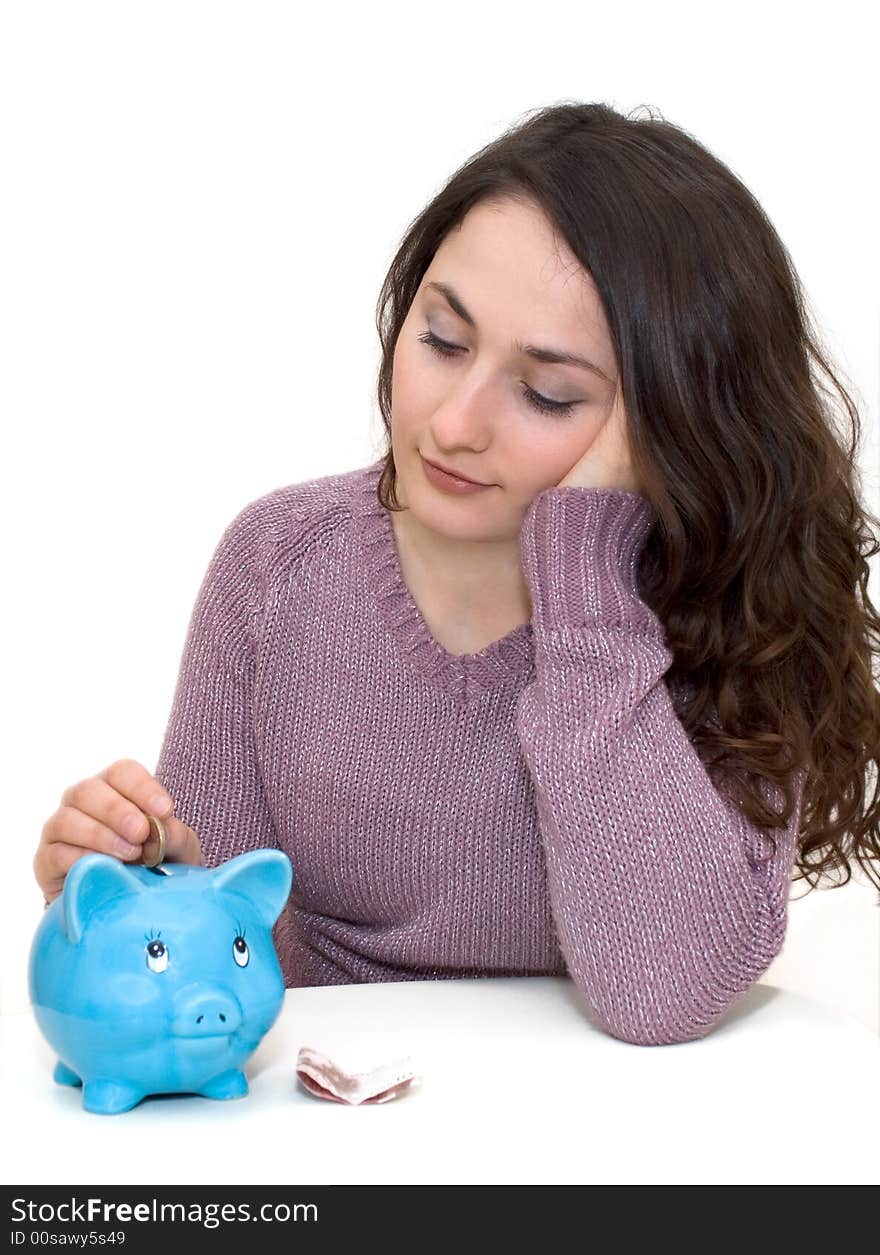 A young attractive woman with blue piggy-bank. A young attractive woman with blue piggy-bank