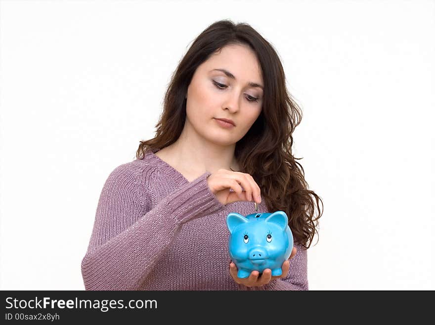 A young attractive woman with blue piggy-bank. A young attractive woman with blue piggy-bank