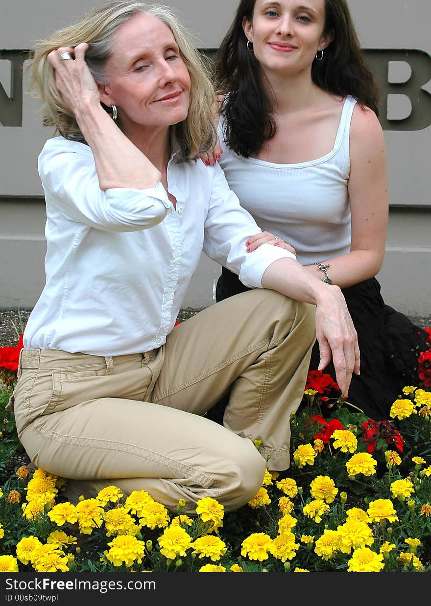 Portrait of a mother and daughter outdoors.