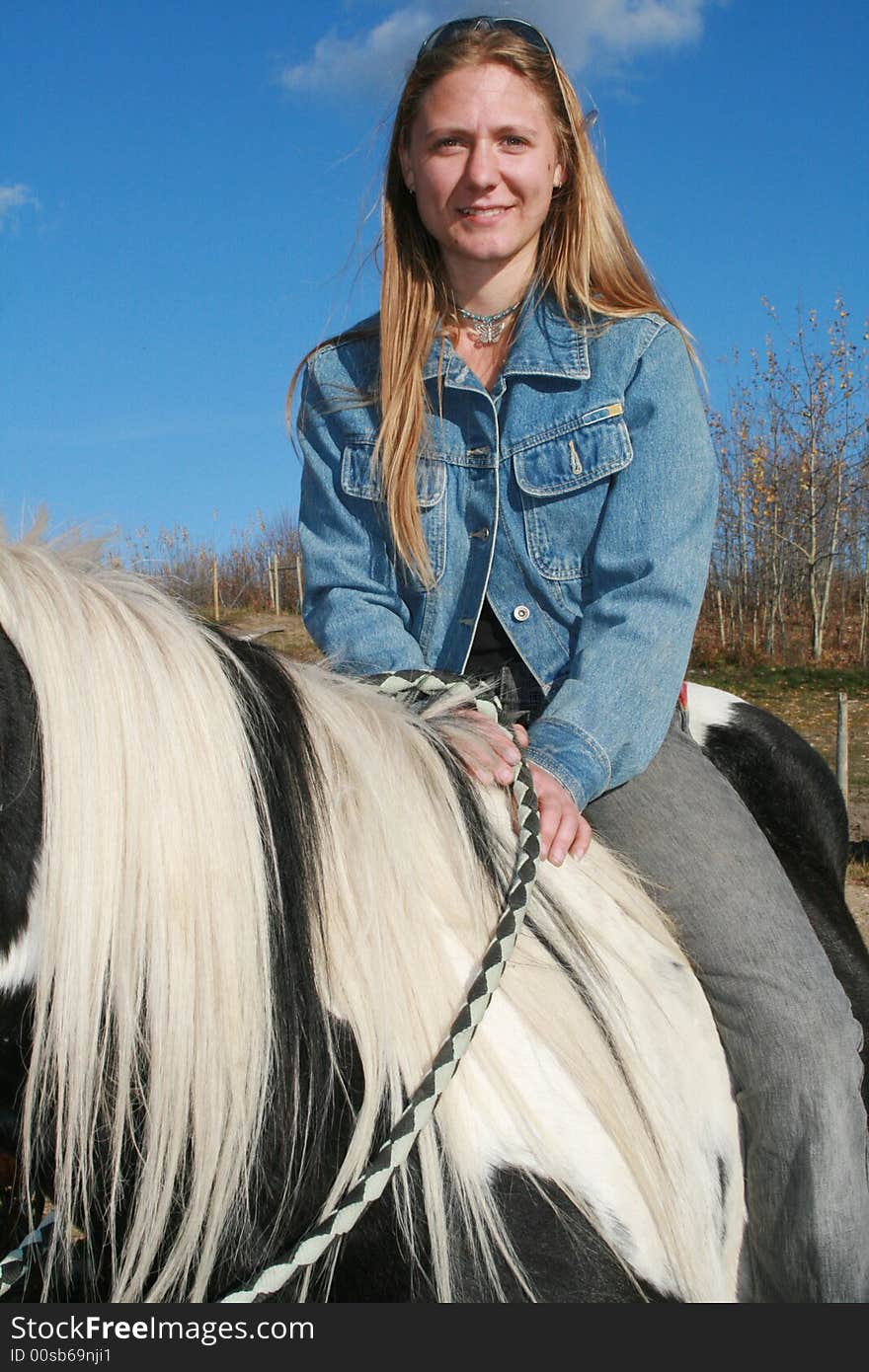 Pretty girl riding bareback on a horse. Pretty girl riding bareback on a horse.