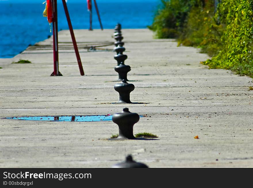 The harbour is empty of ship with a row of cleats