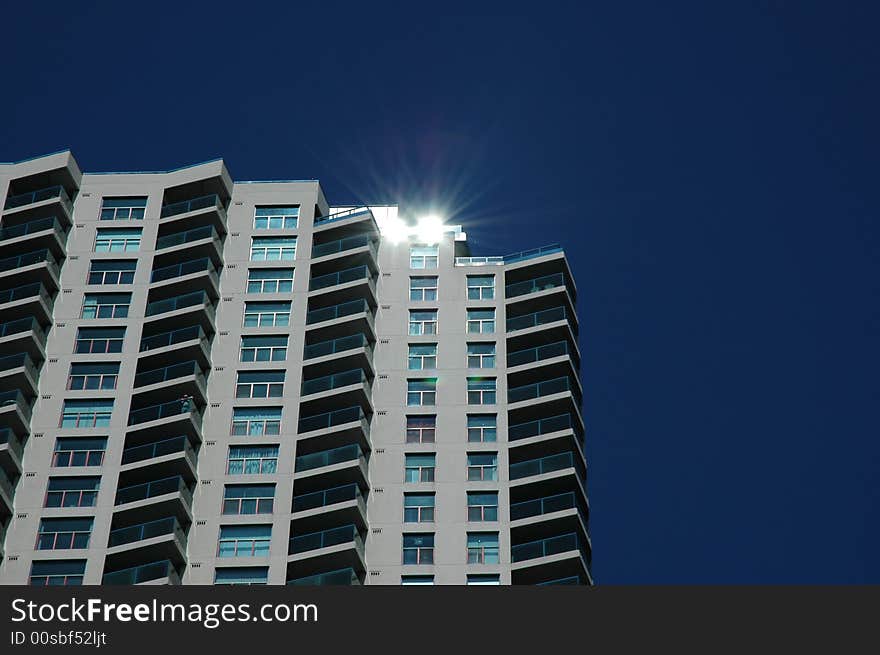 Reflection of the sun off a building on a beautiful day