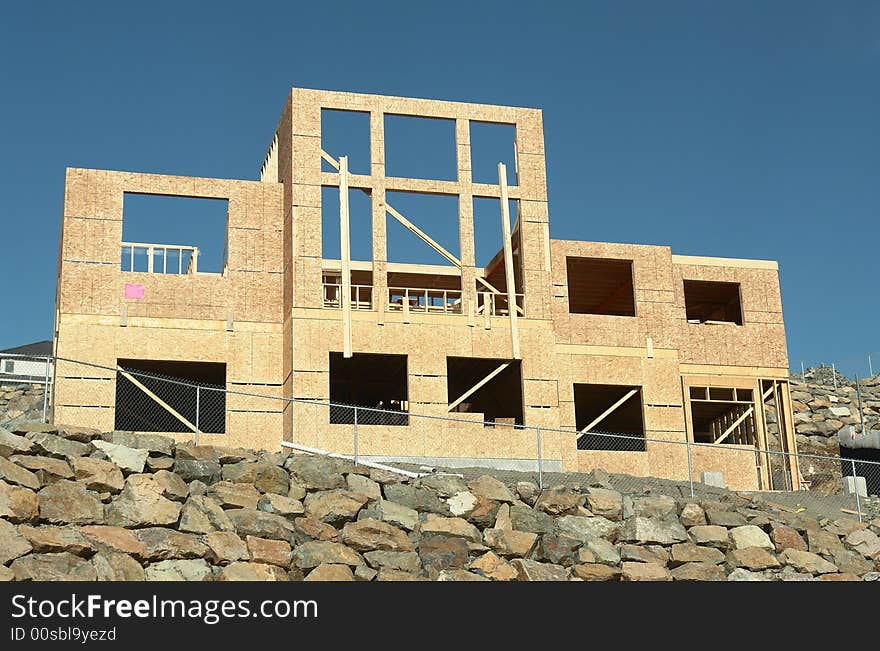 New house construction in the framing stage. New house construction in the framing stage