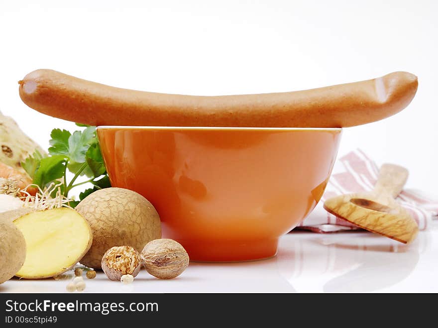 Sausage on a bowl arranged with fresh
vegetables