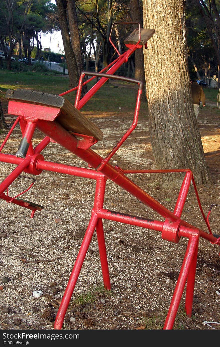 Red vintage seesaw in the playground. Red vintage seesaw in the playground