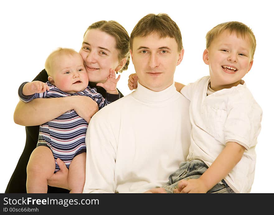 Attractive young family laughing while posing together for a portrait; copy space can be expanded