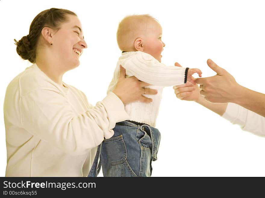 Young boy going from mather's hands to father. Young boy going from mather's hands to father.