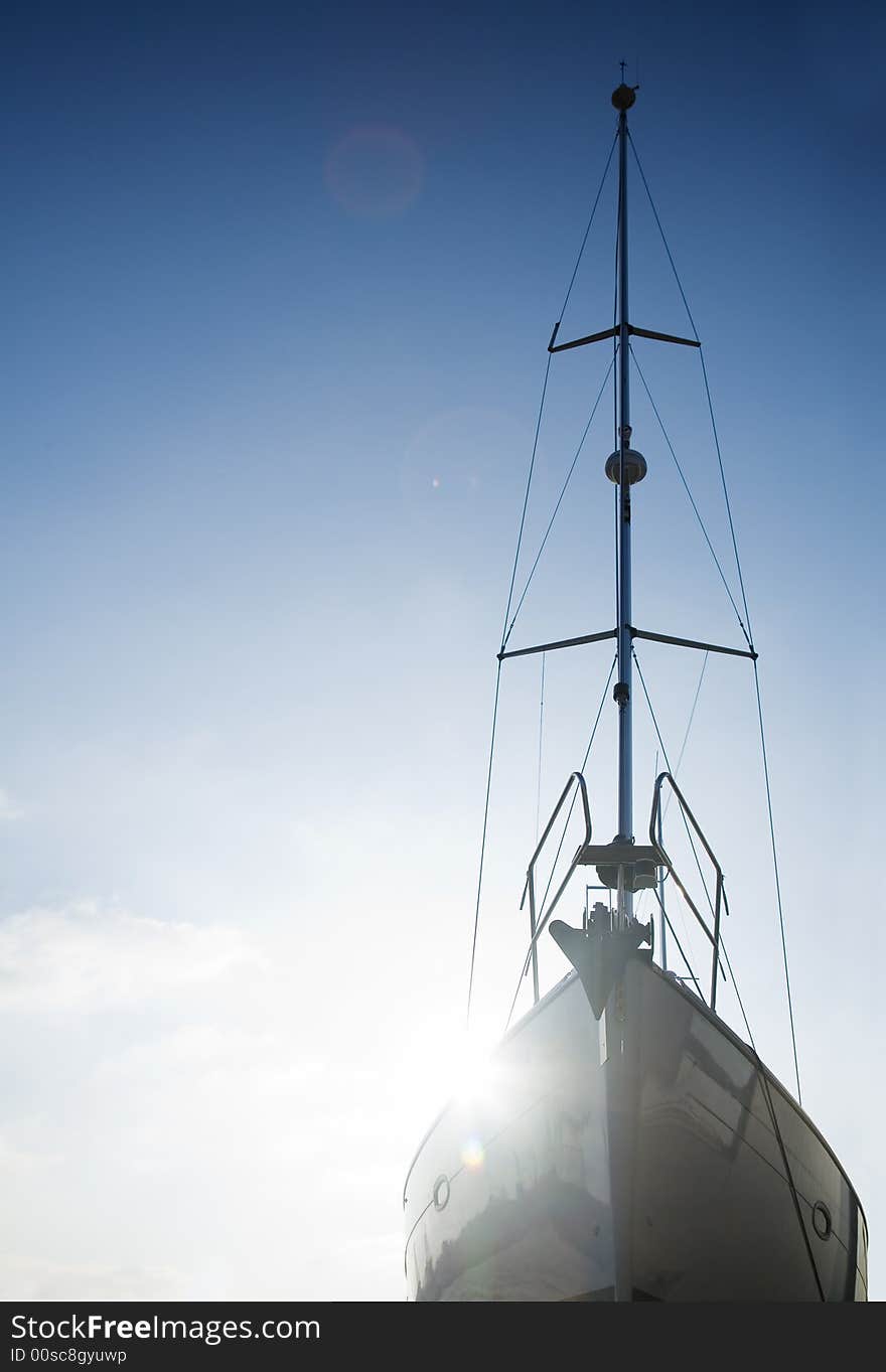 Silhouette if a ship on a blue sky