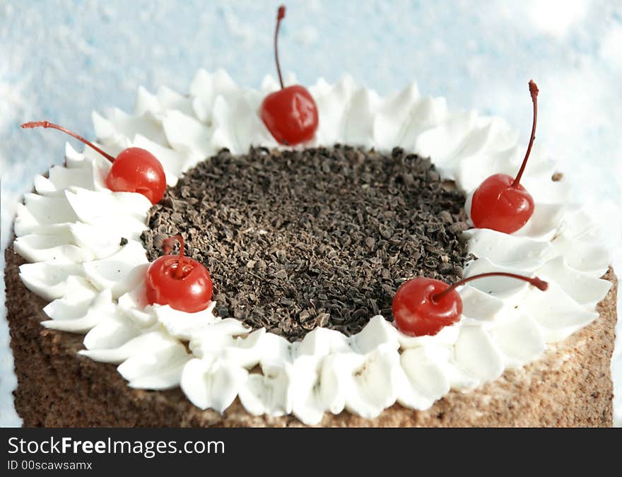 Festive cake with chocolate chip and cherry