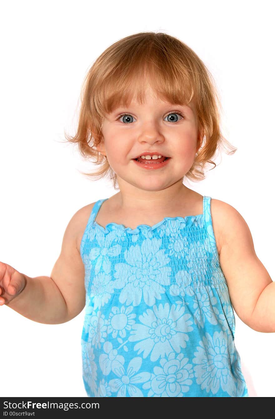 The little girl poses in in blue dress on white background. The little girl poses in in blue dress on white background